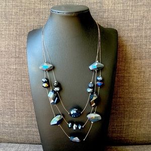 Black, blue necklace.